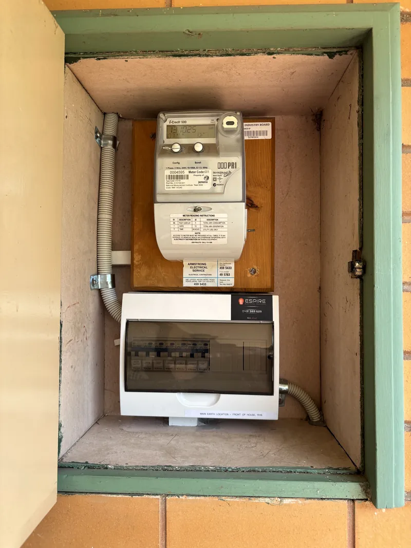 Residential electrical meter and switchboard enclosure serviced by Espire Electrical