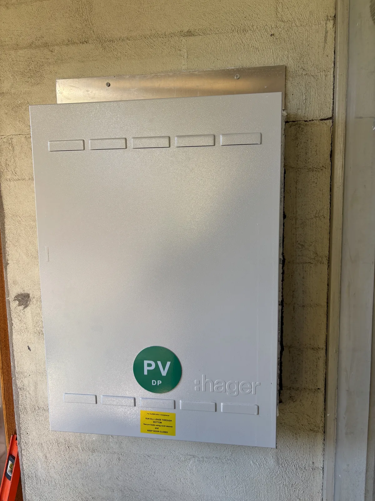 Closed residential switchboard enclosure installed by Espire Electrical