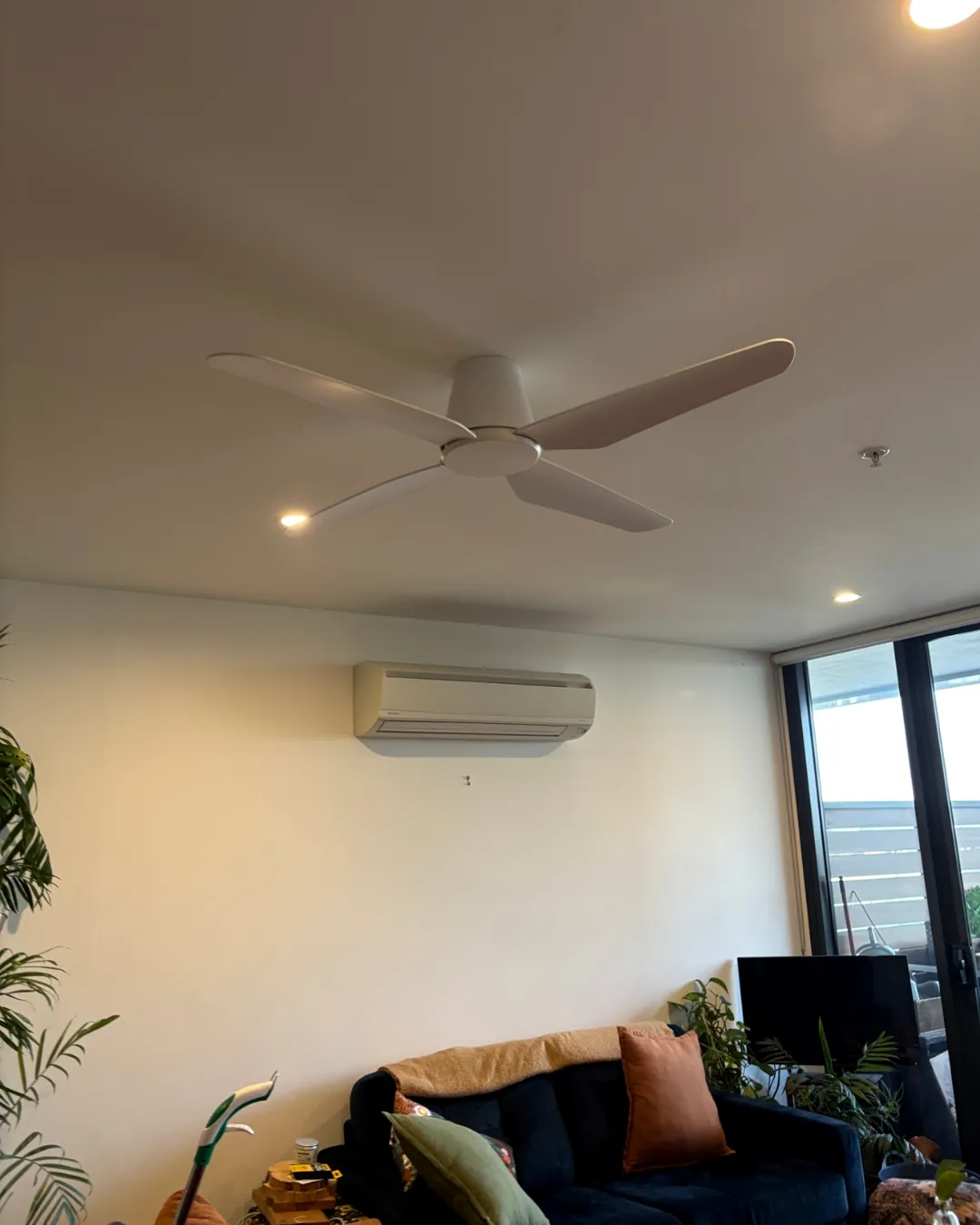 Split system air conditioner in a living room serviced by Espire Electrical