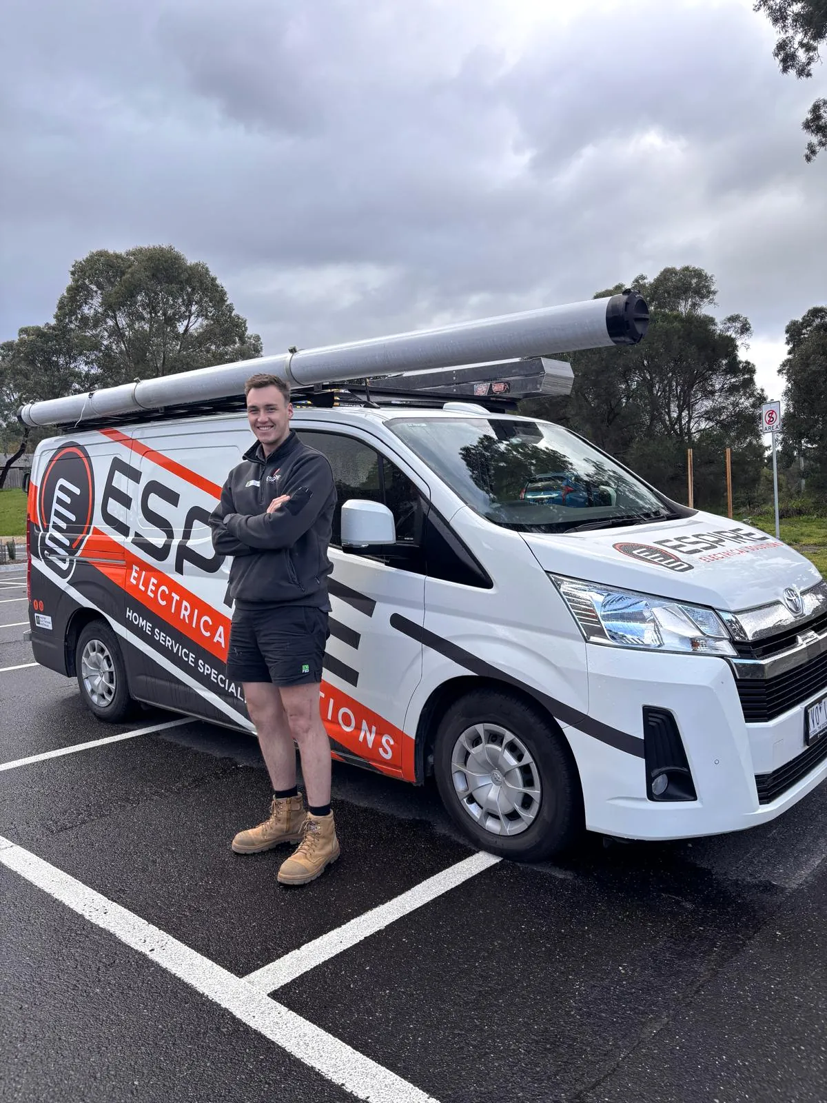 Espire Electrical electrician beside the company van in Melbourne’s north