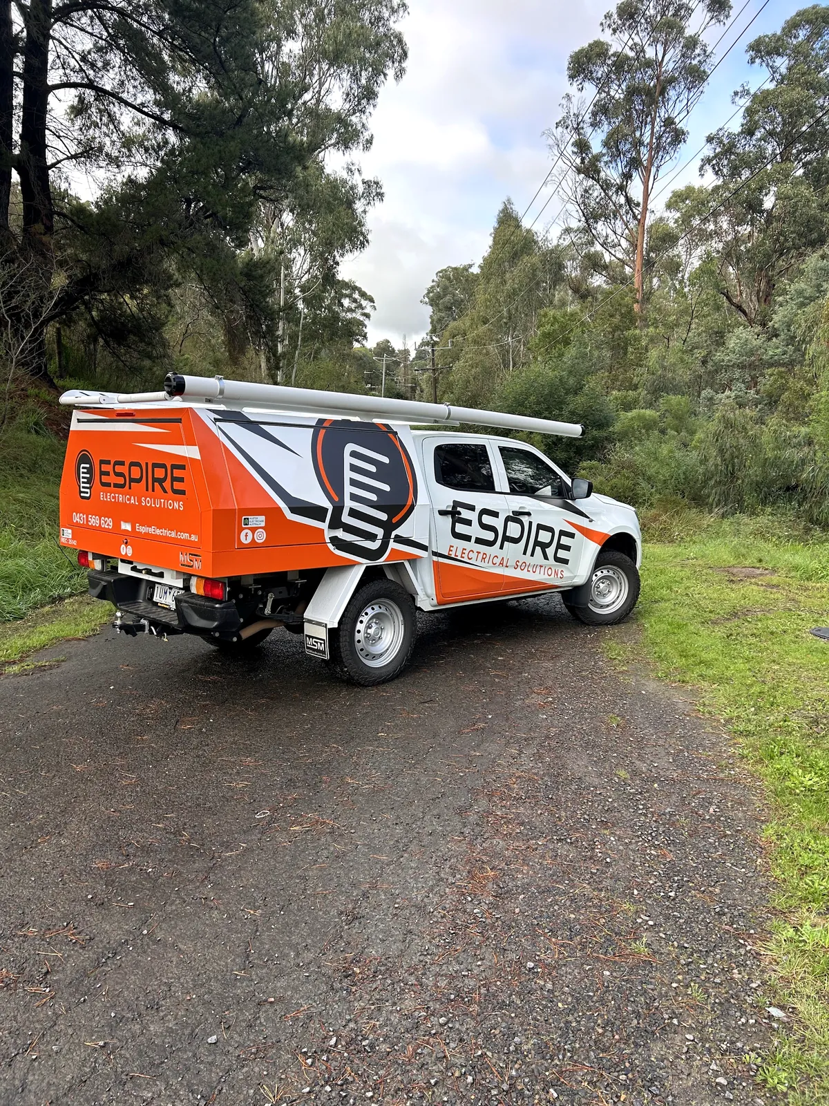 Espire Electrical van beside a leafy road in Melbourne’s north