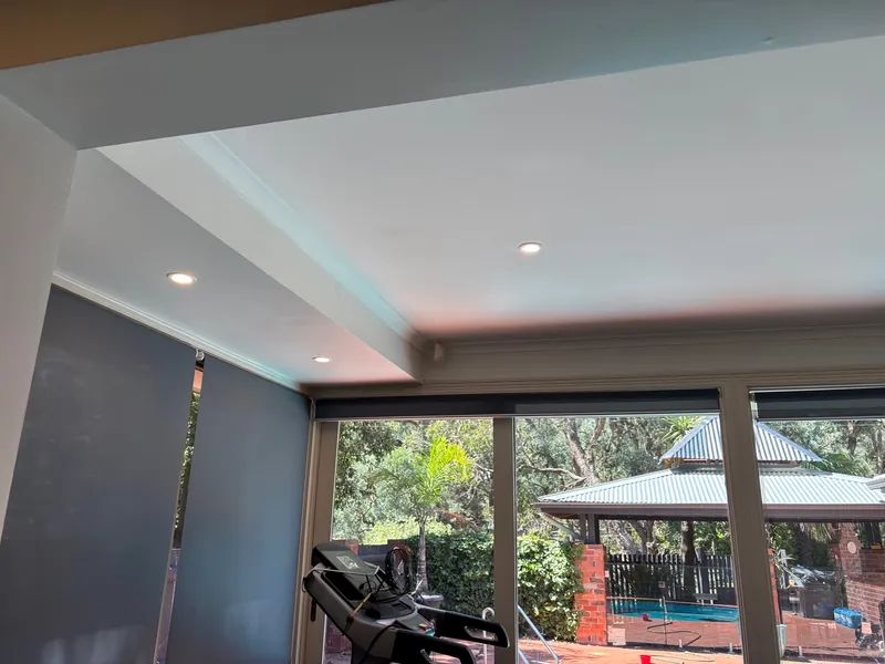 Recessed lighting overlooking a pool in a home serviced by Espire Electrical