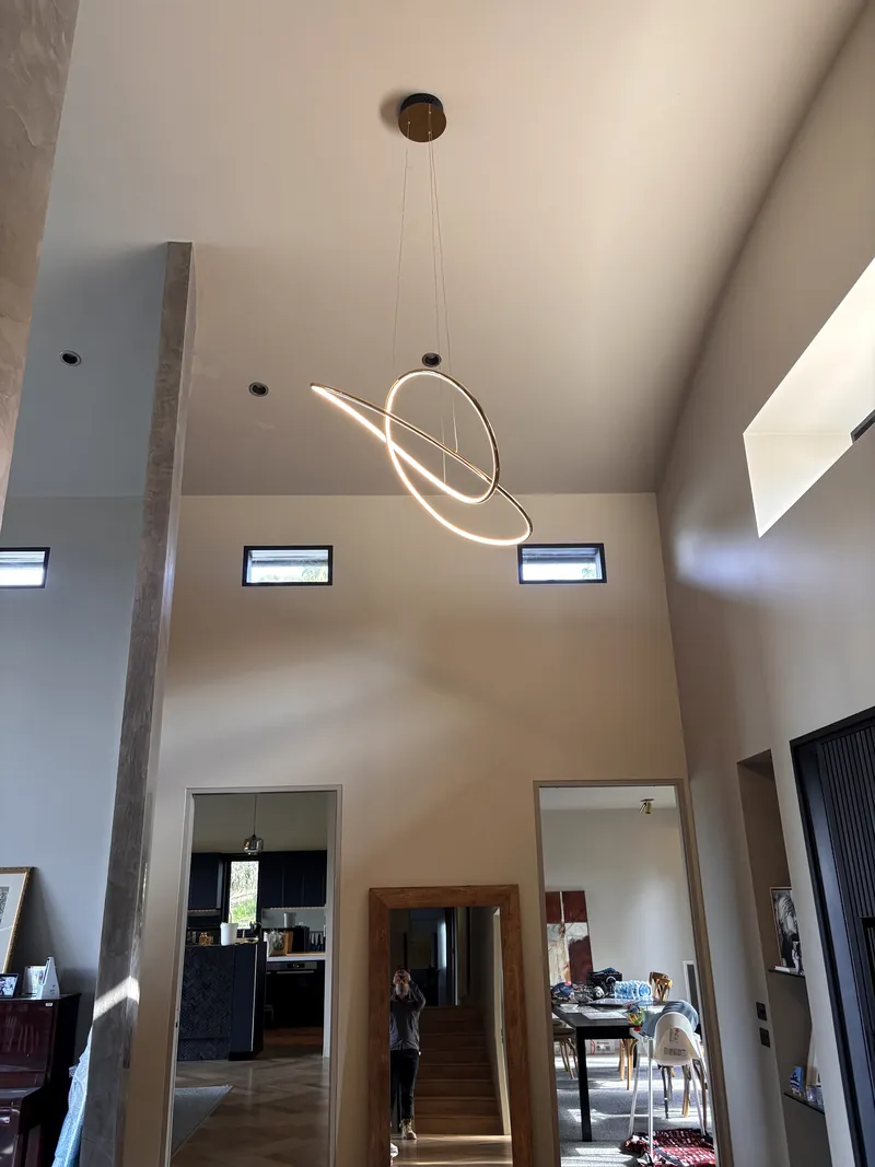 Sculptural pendant lighting in a renovated home by Espire Electrical